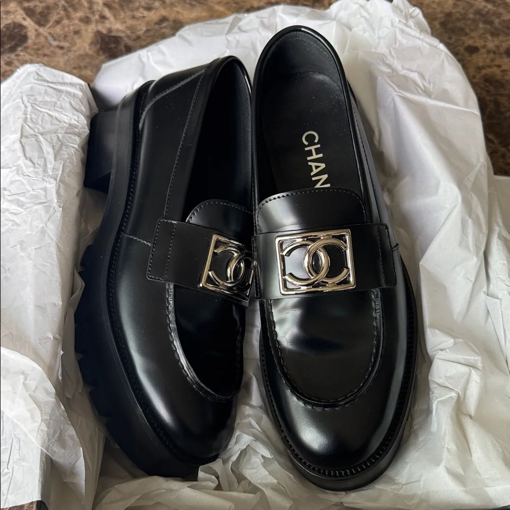 Chanel black shiny calf loafers moccasins chunky flats silver logo sz 37.5